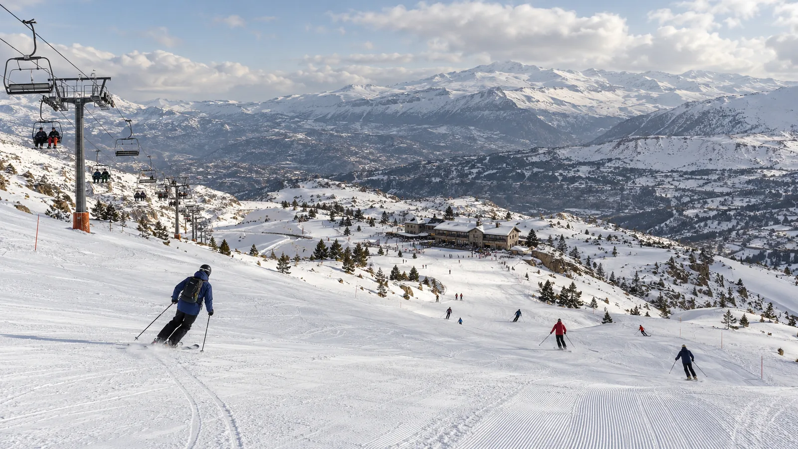 Panoramic snow-covered Lebanese ski resort with groomed runs and mountain lifts
