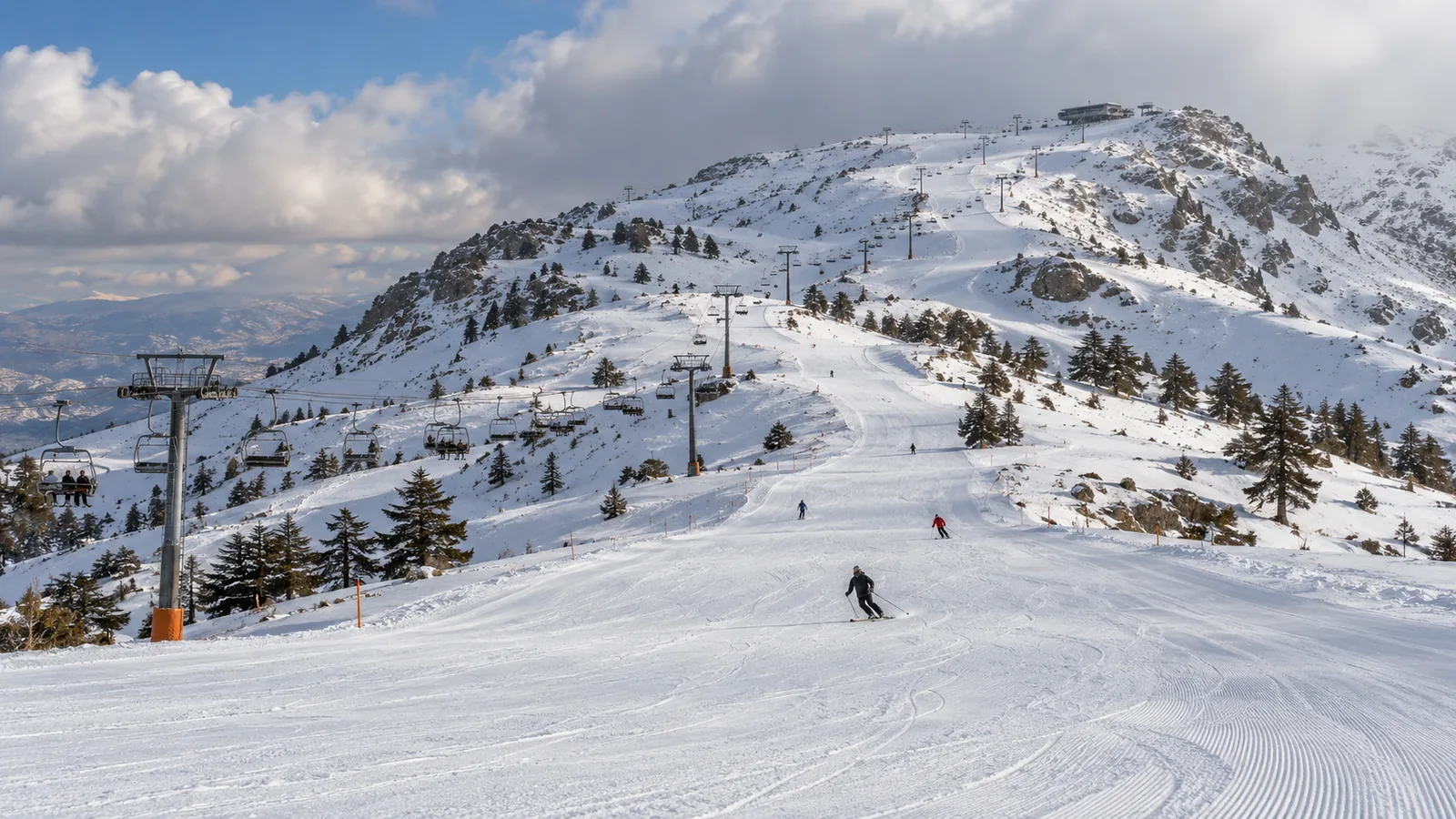 Groomed pistes and lift towers on Mount Lebanon